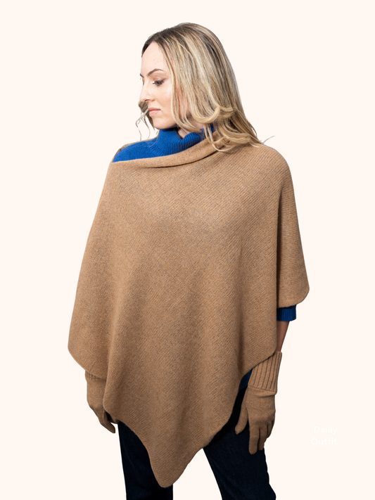 Poncho by Rayaa draped elegantly over a woman, showcasing its cashmere texture and flattering silhouette.
