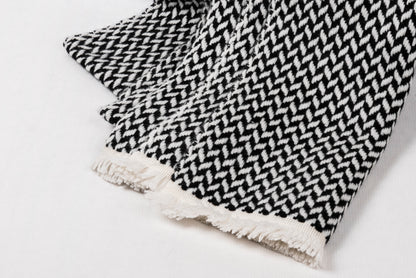 Cashmere Herringbone Narrow Shawl featuring a modern herringbone weave and fringed edges.