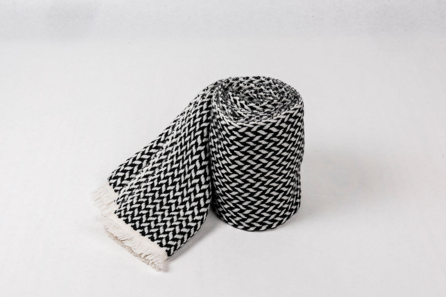 Cashmere Herringbone Narrow Shawl in black and white, soft and lightweight, perfect for elevating style.