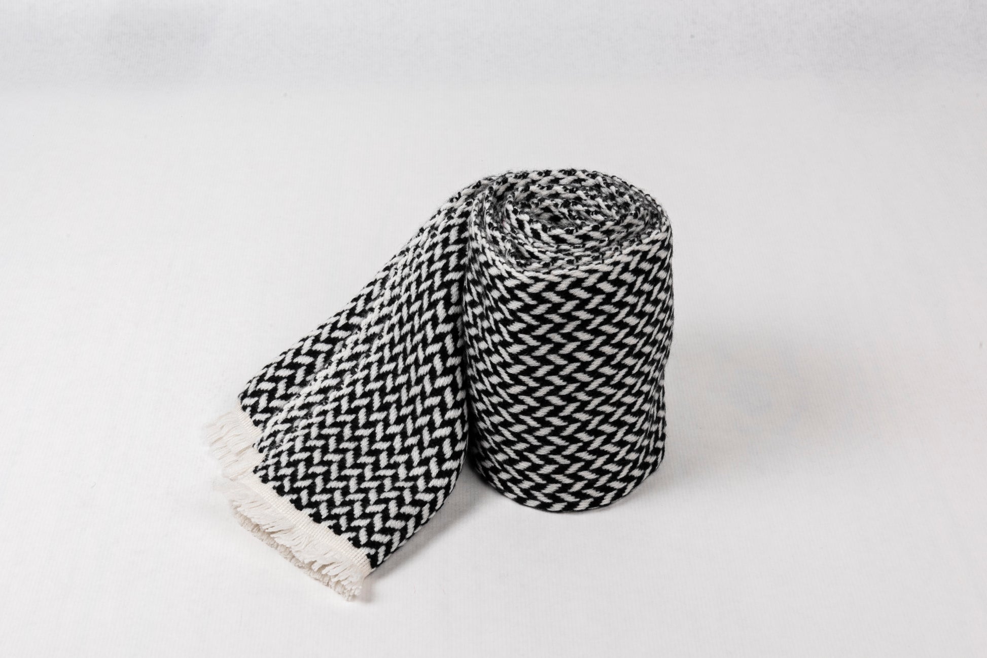 Cashmere Herringbone Narrow Shawl in black and white, soft and lightweight, perfect for elevating style.
