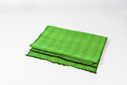 Cashmere Herringbone Scarf Light in vibrant green, showcasing soft and luxurious texture perfect for any outfit.